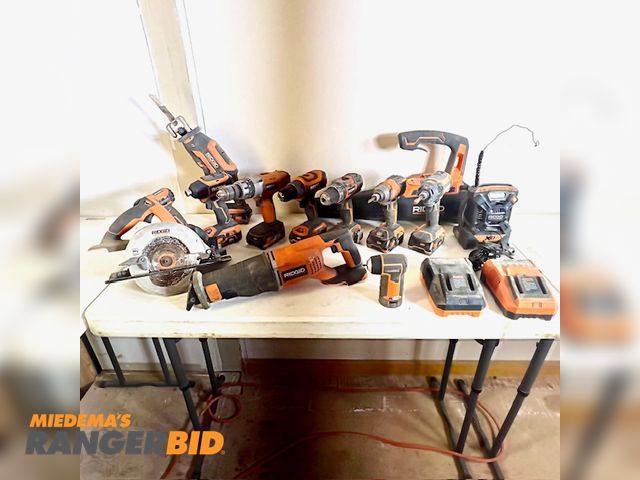 Lot 30-518 - 22 Rigid batteries, chargers, reciprocating saws, drill-drivers, blower, radio-iPhone charger, circular saws