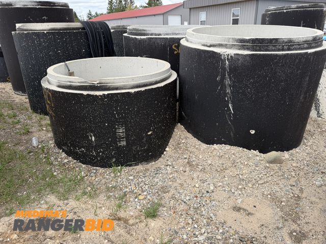 Lot 30-5858 - Lot of (4) 4' diameter concrete manhole tubes, includes 3 approx. 48" tall, and 1 approx. 32" tall.