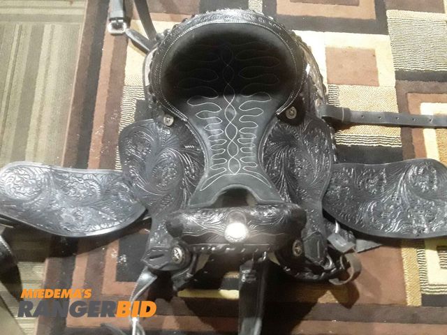 Lot 30-11235 - 1 The original by reinsman horse . 17" black horse saddle great shape  be the winner of this item if...