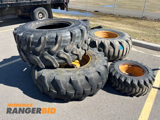 Lot 30-489 - (4) Backhoe tires - (3) with rims