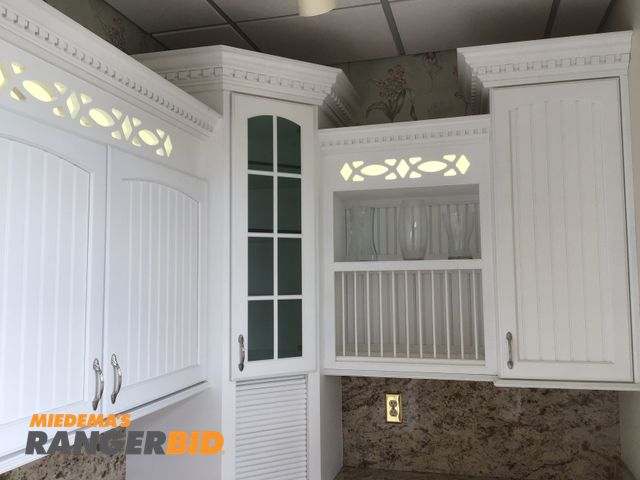 Lot 30-10594 - Display kitchen Includes Hand crafted custom cabinetry, granite counters.