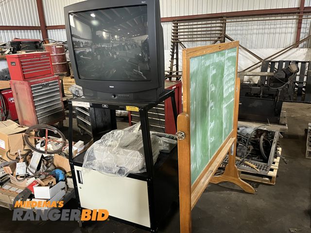 Lot 30-874 - Lot includes TV, Flip able chalk board, projector, dvd / vhs player, as well as TV cart