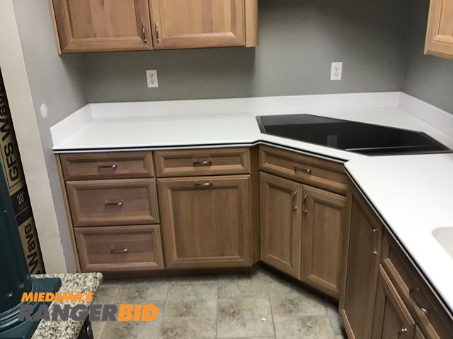 Lot 30-10592 - Display kitchen Includes Hand crafted custom cabinetry, granite counters.