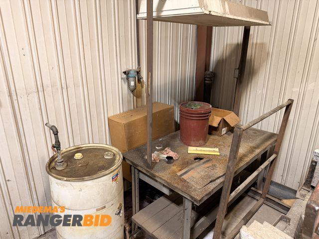 Lot 30-3150 - Lot includes: Drum Grab, Work Bench, Drum with pump, Metal Rack, and spool of wire.