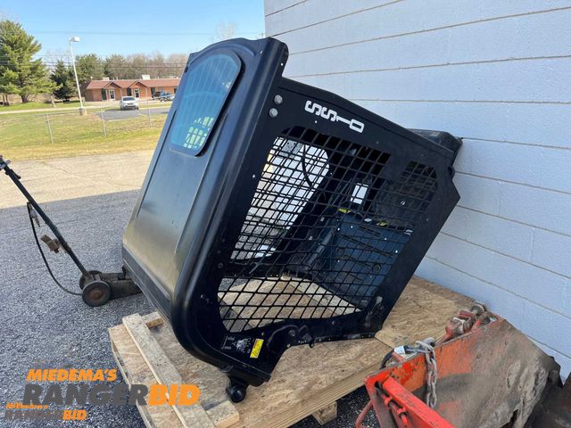 Lot 30-3200 - Skid Steer Cab / Roll Cage. Please note it does have some damage to the mesh. (see last pi...