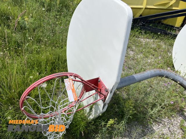 Lot 30-1165 - (1) 10' Basketball Hoop with Pole Metal, has concrete on the bottom.
