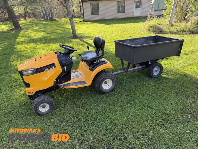 Lot 30-11106 - 2018 Cub Cadet  XT1 Riding Lawn Mower Runs/drives good, comes with dump trailer (trailer needs 1 tir...