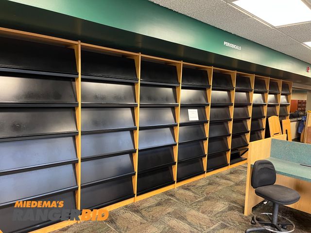 Lot 30-3357 - Lot includes all the magazine racks, and book shelves shown.