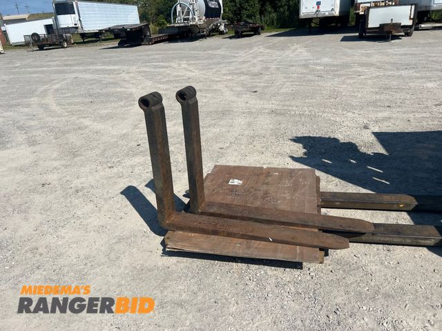 Lot 30-20627 - Matching pair of lift truck forks.  47" long X 6" wide X 2 3/8" thick.  2 3/8" diameter hole located...