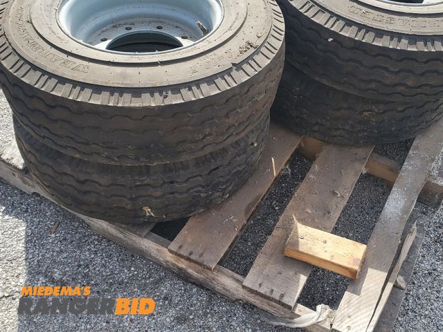 Lot 30-10329 - (4) Tires with Rims 9 bolt pattern 7 7/8 center Foam Filled