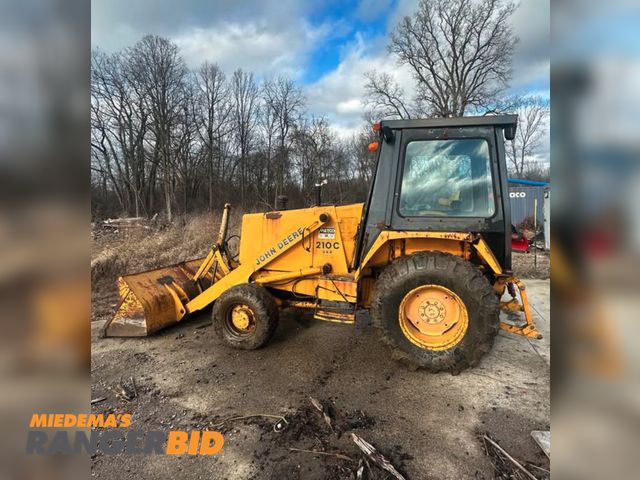 Lot 30-10471 - John Deere 210C Loader Tractor Starts runs and Operates.  Seller will assist with loading.