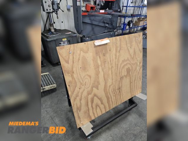 Lot 30-1351 - Assembly Table and lots of Wire Way and overs.  Table tilts, rolls,, and has wheel brakes.  Was used...