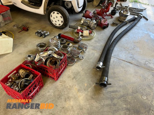 Lot 30-3537 - Various fire fighter equipment shown, hoses, sprayers and more.