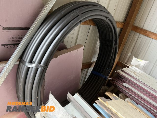 Lot 30-5750 - (1) new roll (length unknown) of 1 1/4" Oil Creek Aqua Jet pipe PE4710 ASTM (125 PSI).
