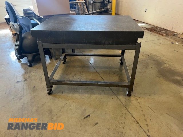 Lot 30-10674 - 3ftx3ft granite top table on wheels, heavy duty metal frame, with a 6inch thick granite top, was use...