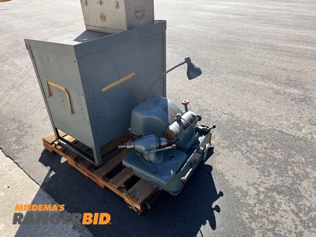 Lot 30-2934 - Stoux 645 L Valve Face Grinding Machine Comes with cabinet and all the tooling shown In good condition.
Municipality owned. Seller will load.