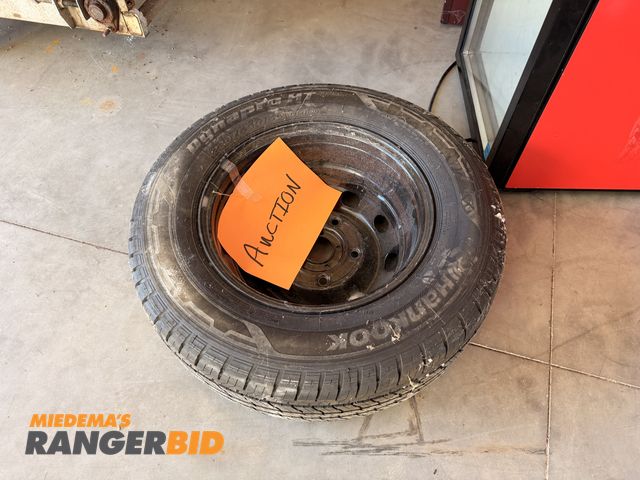 Lot 30-3675 - Hankook 23.5 / 65R 16C Tire with rim.