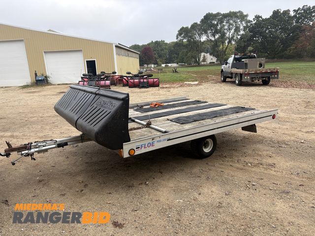 Lot 30-10724 - Floe Tilt Deck 2 Place Snowmobile Trailer Aluminum Floe Snowmobile trailer, track grips and ski slid...