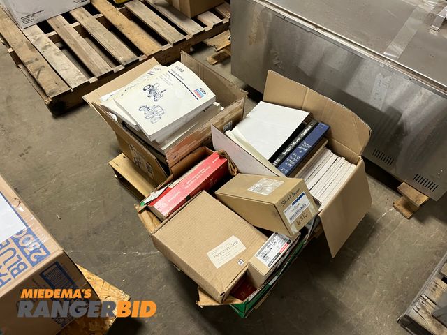 Lot 30-3484 - Lot includes pallet of manuals for tractors, and trucks Located in the North building
