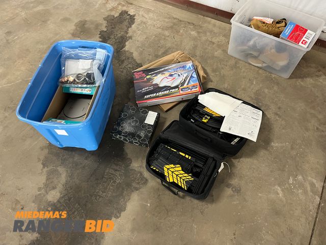 Lot 30-2490 - lot includes Pole Position and Super Grand Prix race sets, Playstation, Jewelry, and Billi...