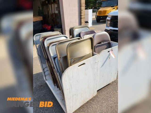 Lot 30-3851 - 25 Steel Chairs Approximately 25 steel folding chairs and wooden storage carts. Chairs were in use until June 2024. Sold as is.
