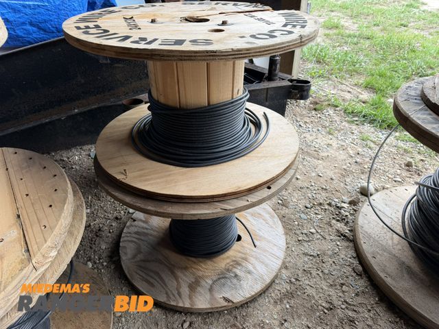 Lot 30-5758 - (2) partial spools of 6 gauge, 7 strand copper wire with black coating.
