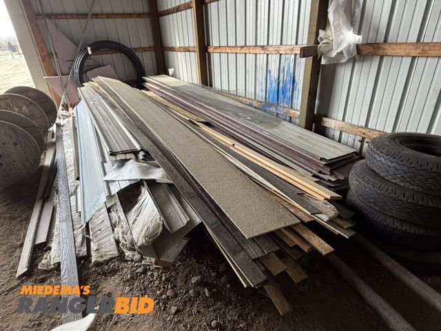 Lot 30-5749 - Large lot of assorted cuts of steel siding, lumber, composite siding, OSB siding corner and trim pie...
