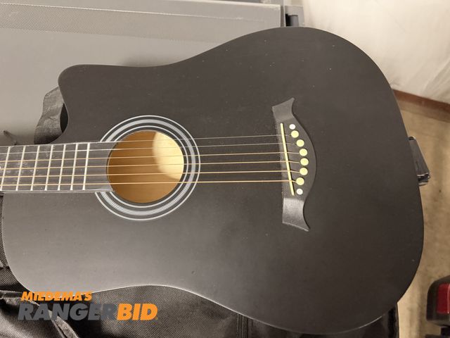 Lot 30-3343 - Zero Foundation . Acoustic Guitar Comes with case and extra items. In good condition.
