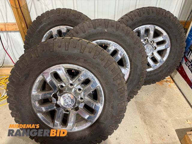 Lot 30-10144 - (4) 2016 Chevrolet 8 Lug Rims with Goodyear Tires LT 275 / 70R18