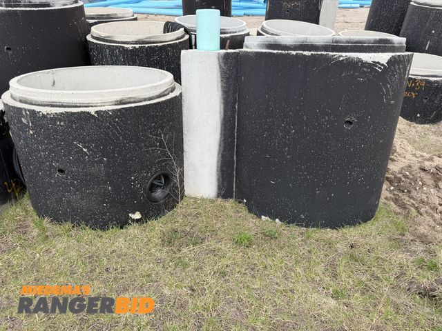 Lot 30-5857 - Lot including (1) 41" tall concrete manhole tube with 4' diameter entry, and (1) 53" tall concrete m...