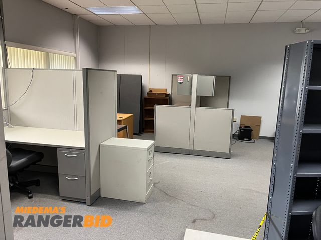 Lot 30-4096 - Lot includes 4 cubicles with filing cabinets, desks, chairs, overhead compartments, and more. Buyer is responsible for removal.