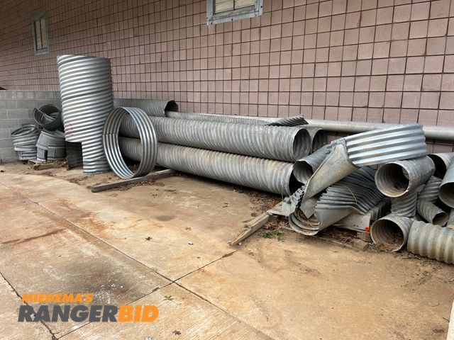 Lot 30-3389 - Metal Culverts Comes with all the culvers shown, EXCEPT the large on that is standing upright.  The 18" dia pipes are 20' long.
Municipality owned. Seller will load.