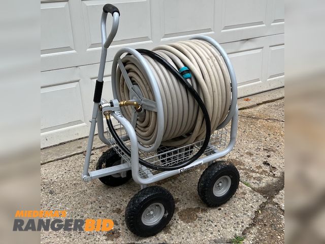 Lot 30-9818 - Hose reel cart Fully assembled hose reel cart with 350' 3/4 inch garden hose. Keeps your hose organized and portable.