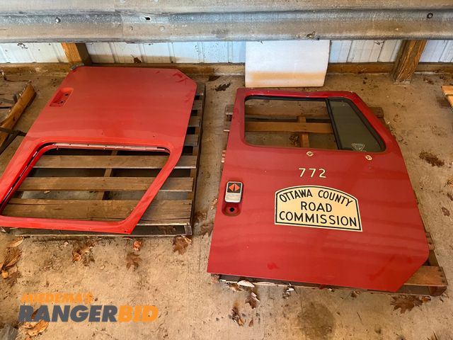 Lot 30-2909 - 2 (2) doors, one new never used and 1 used. Both are off International S Model