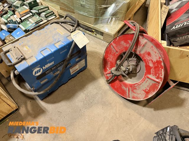 Lot 30-3157 - Lot includes Miller Welder and Reel with hose.