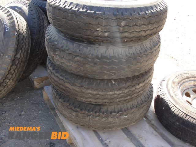 Lot 30-4857 - 4 8-14.5 LT tires and wheels