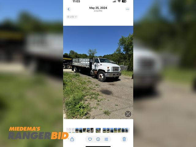 Lot 30-10251 - 1998 GMC C-series stake Flatbed Truck This is a very good running truck, has brake leak, may need wo...