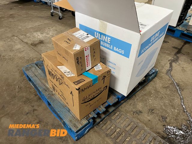 Lot 30-3485 - Lot includes the items on this pallet. Box of Uline bubble bags, Desk lamp, glass Volumetric flasks