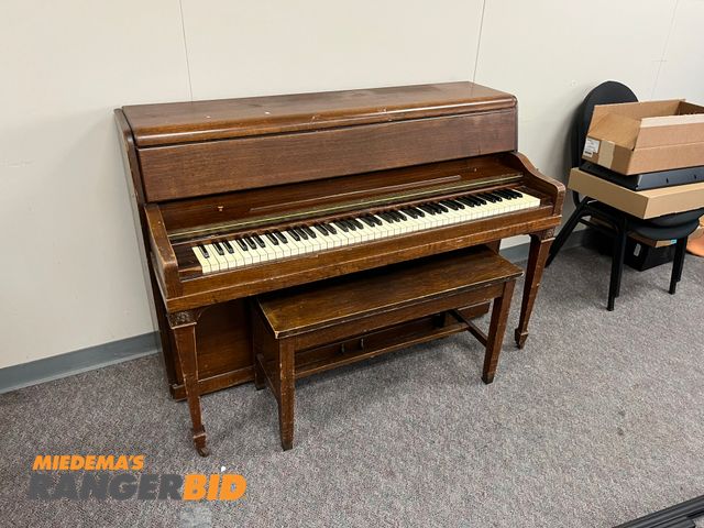 Lot 30-3363 - 1 Grinnell Bros Piano Comes with bench. Buyer is responsible for removal.