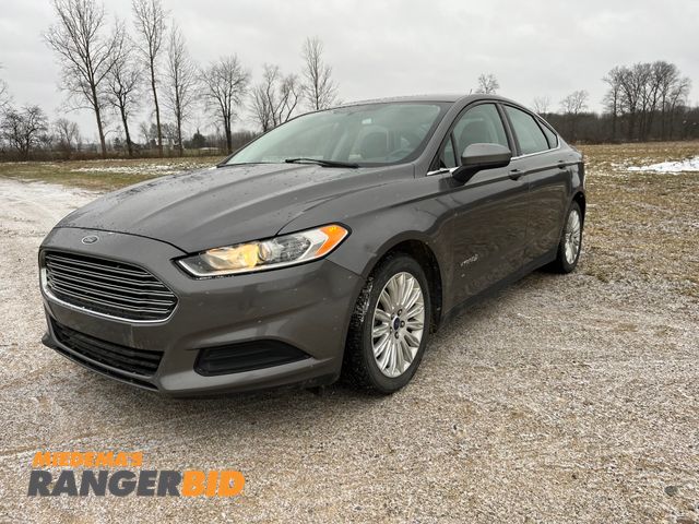 Lot 30-620 - 2014 Ford Fusion Hybrid with a 2.0L L4 DOHC 16V HYBRID engine. S with 86,143 miles Sedan Hybrid FWD