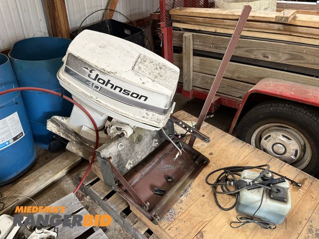 Lot 30-1613 - Johnson 40 2 stroke boat motor with steering column