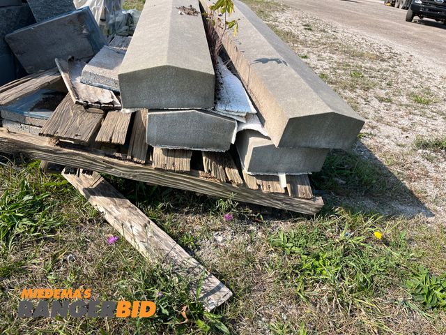 Lot 30-3434 - (4) Concrete Parking Lot Blocks Also comes with blue pavers. Seller will load.