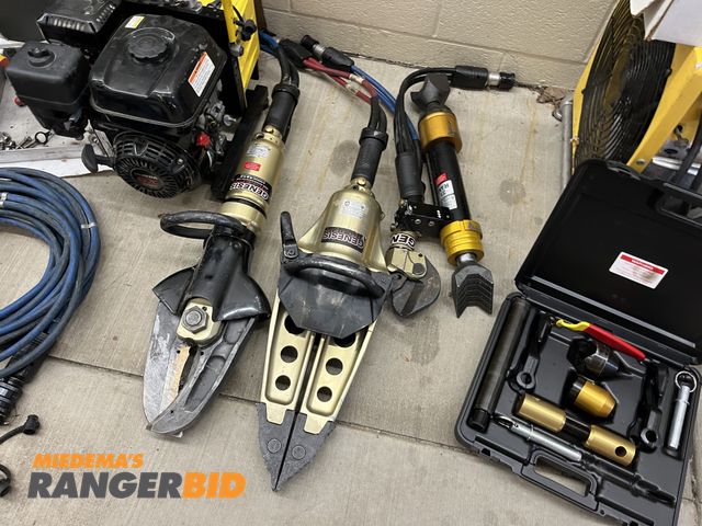 Lot 30-1557 - This lot includes everything shown- Jaws of life cutters and spreaders, 2 hydraulic hose reels with ...