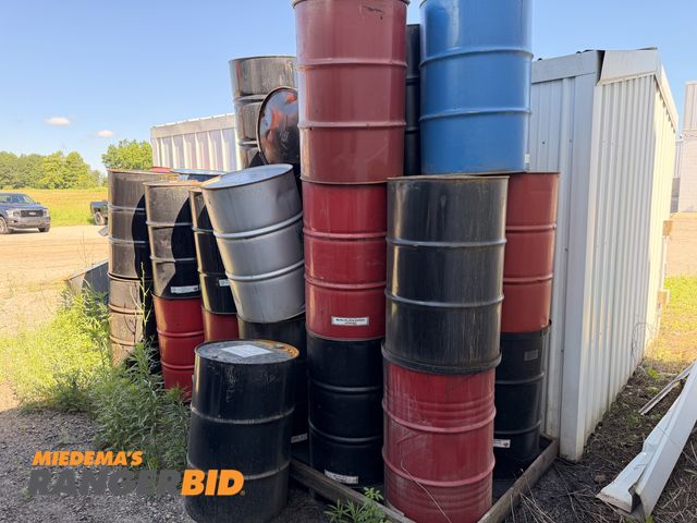 Lot 30-3989 - Pile of empty 55 gallon drums.