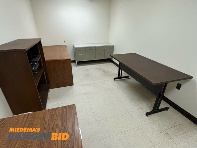 Lot 30-1201 - Small lot, two wooden desks, shelving unit, 8 drawer unit (metal) miscellaneous table. Buyer is responsible for removal.