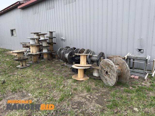Lot 30-5779 - Large lot of assorted empty wood wire spools, includes (1) plastic spool, and (9) custom made wood s...