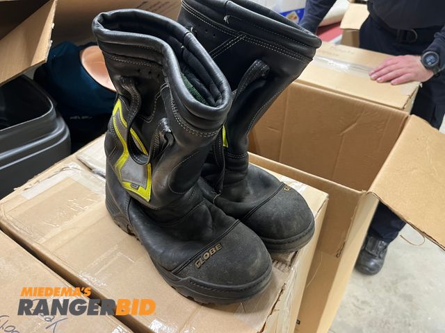 Lot 30-2866 - 4 boxes of used fire fighter boots most sizes are 9-12
