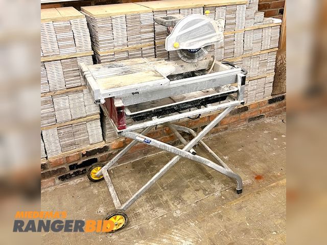 Lot 30-0 - 1 Chicago Electrtic 69275 Electric Powered Tile Saw Chicago Electric Model 69275 fully assembled 2.5 horsepower 10 inch industrial tile and brick saw.  Wheels and folding frame for easy transport.