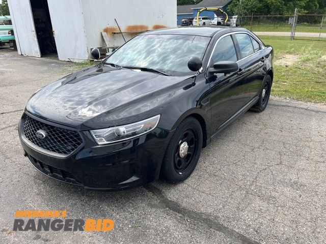 Lot 30-990 - 2016 Ford Taurus with a 3.7L V6 DOHC 24V engine. Police with 65,569 miles Sedan AWD