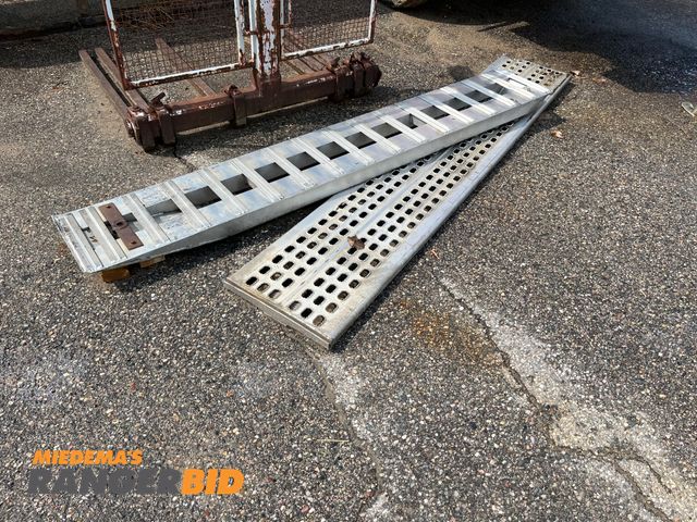 Lot 30-3918 - Lot includes (1) ramp and (1) ramp type item or scaffolding plank. Both appear to be aluminum.